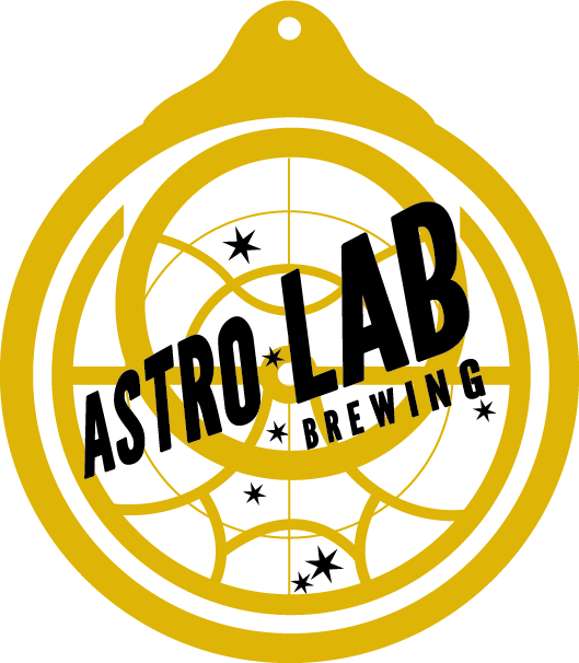 A gold-colored circular Astro Lab Brewing logo featuring a celestial navigation pattern and small stars.