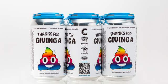 Three cans of DuClaw Brewing Co. Sour Me Unicorn Farts beer, each featuring a colorful rainbow poop emoji graphic and the text “Thanks for giving a.”